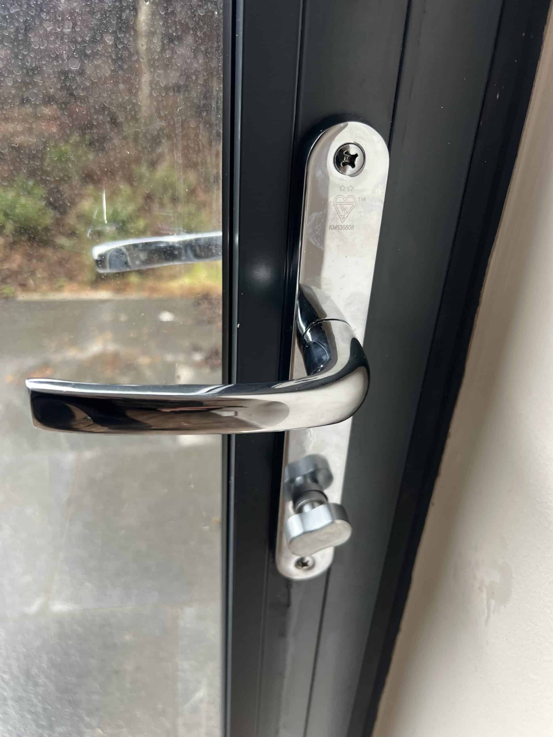 A picture of a newly fitted residential door handle and lock on a Formby property, taken from the inside.